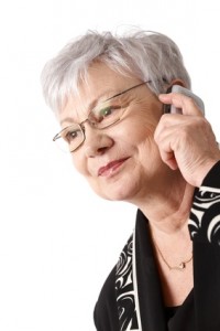 Closeup portrait of older woman with mobile phone